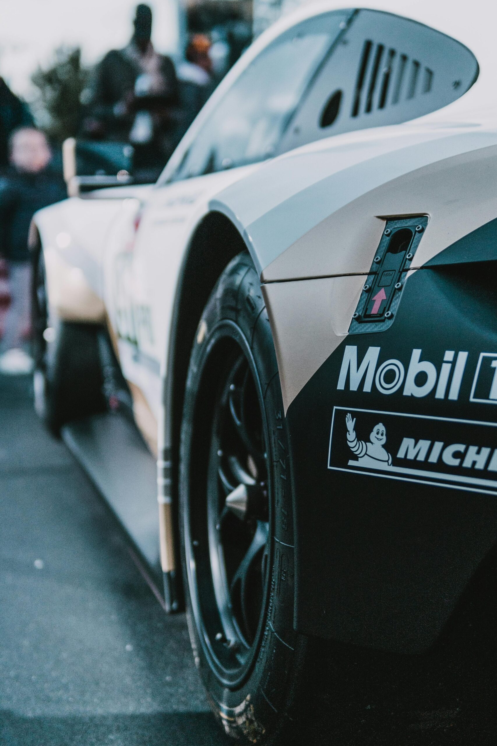 Dynamic capture of a stylish racing car in a motorsport event, showcasing speed and design.